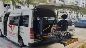 toyota hiace hiroof maxicab wheelchair transport wheelchair taxi with hydraulic lift deployed wheelchair user on the lift