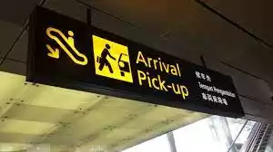 singapore maxi cab airport transfer changi airport picture showing a directional sign to arrival pick up